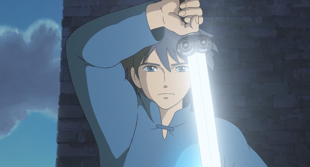 earthsea-2 - junglecity.com Young man in a blue tunic raises a glowing blue sword beside a stone wall, ready for battle.