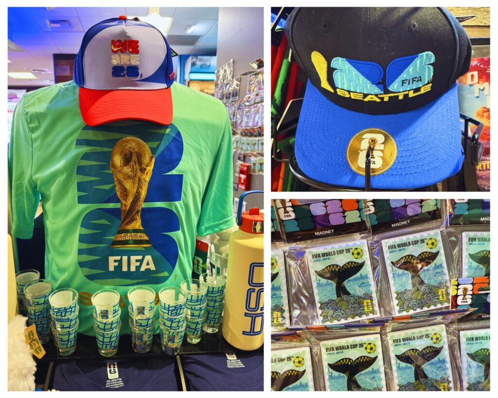 Split image of FIFA World Cup merchandise: left panel shows a lime green shirt with a trophy graphic and a red brim hat, with plastic cups in front. Right panel shows a blue and black cap with a FIFA Seattle design and yellow lettering, plus packaged cards or magnets beneath.