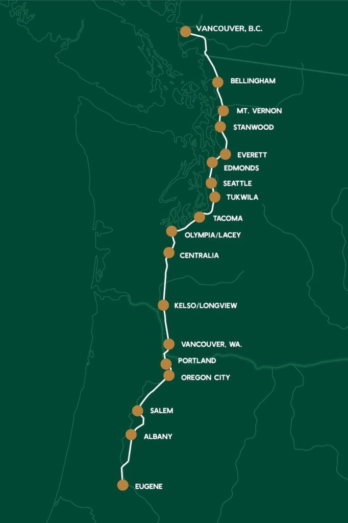 Rail line map showing a white route with orange station dots from Vancouver, BC to Eugene, OR, with city labels along the route (Seattle, Tacoma, Olympia/Lacey, Portland, etc.). NOTE: informational route map for a Northwest rail corridor.