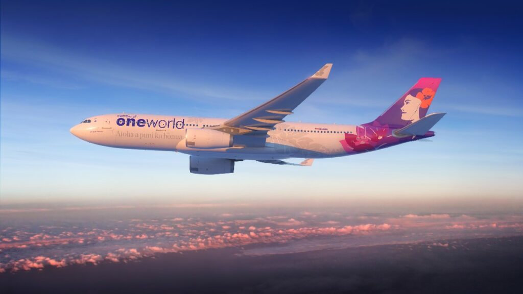 a330-2 - junglecity.com Airplane in flight over a sunset sky with pink clouds, showing a pink-purple tail artwork and the 'oneworld' branding on the fuselage